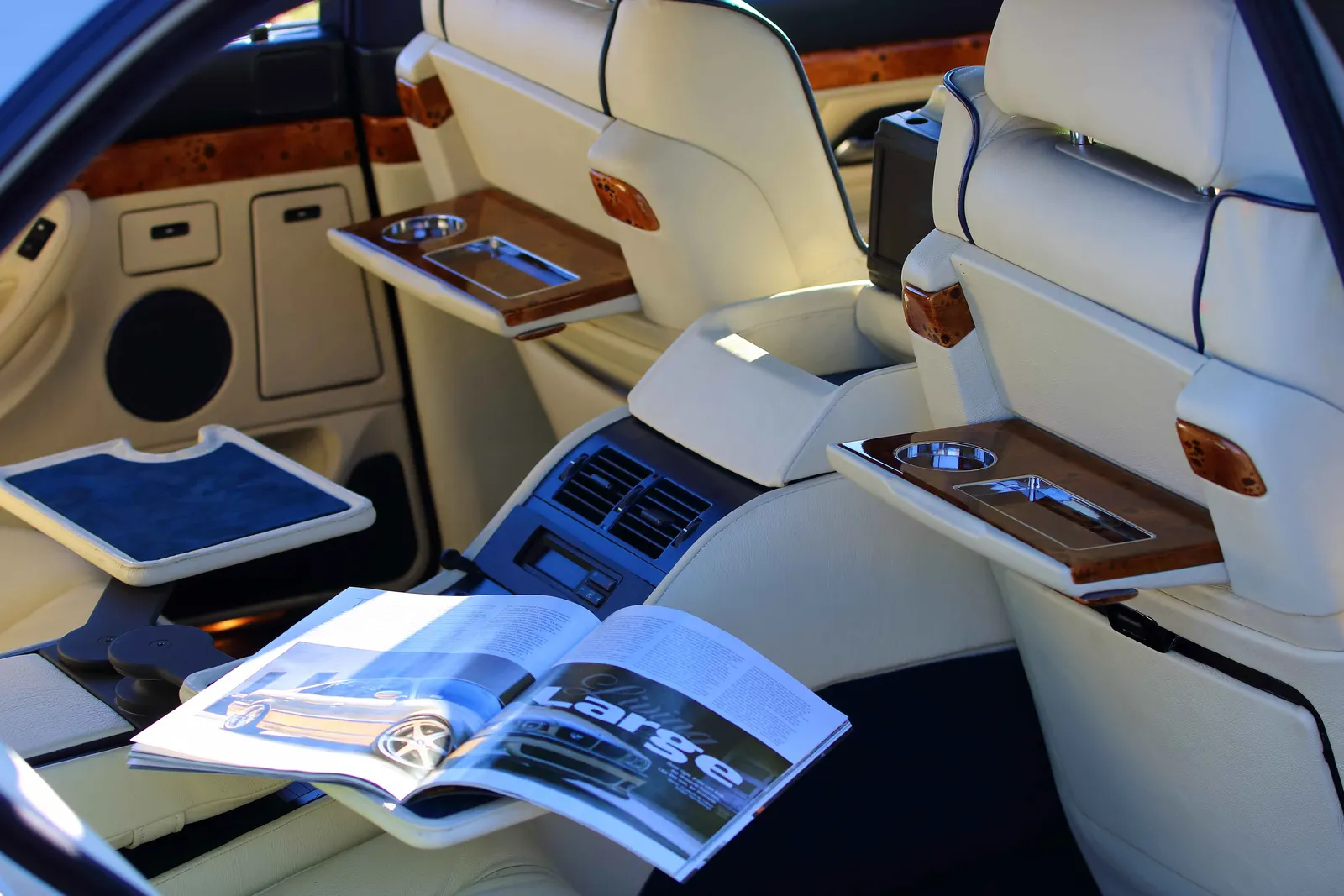 BMW E38 rear cabin in cream leather with fold-out wood picnic tables